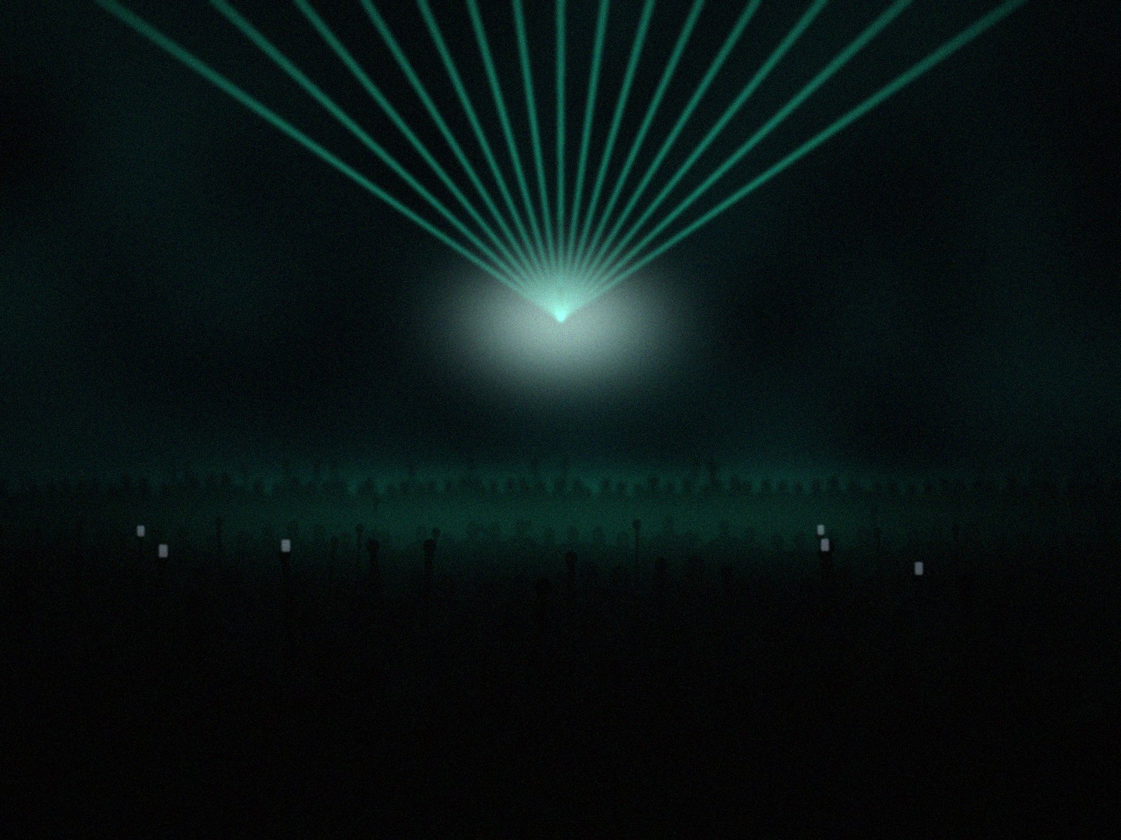 Green lasers fanning out over a dance floor